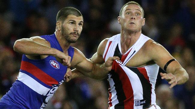 Koby Stevens battles David Armitage for the ball. Picture: George Salpigtidis