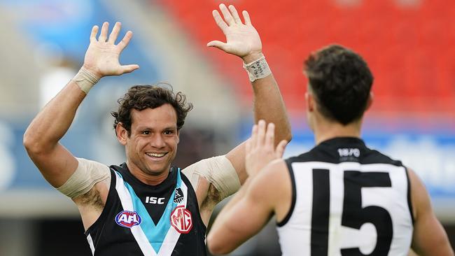 Steven Motlop and Karl Amon enjoy a goal in Port Adelaide’s win.