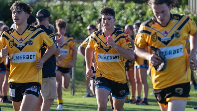 Sunshine Coast Falcons Mal Meninga Cup Tait Coghlan (middle) runs out to the field. player Picture: Kylie McLellan/Kyliesfootyphotos.