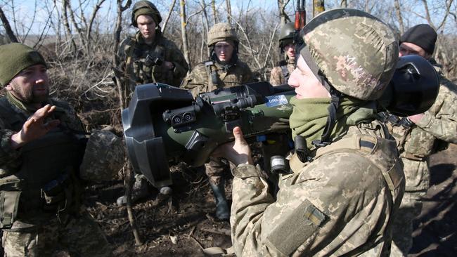 Ukrainian Military Forces on the frontline with Russia-backed separatists near Novognativka village, in the Donetsk region. Picture: AFP