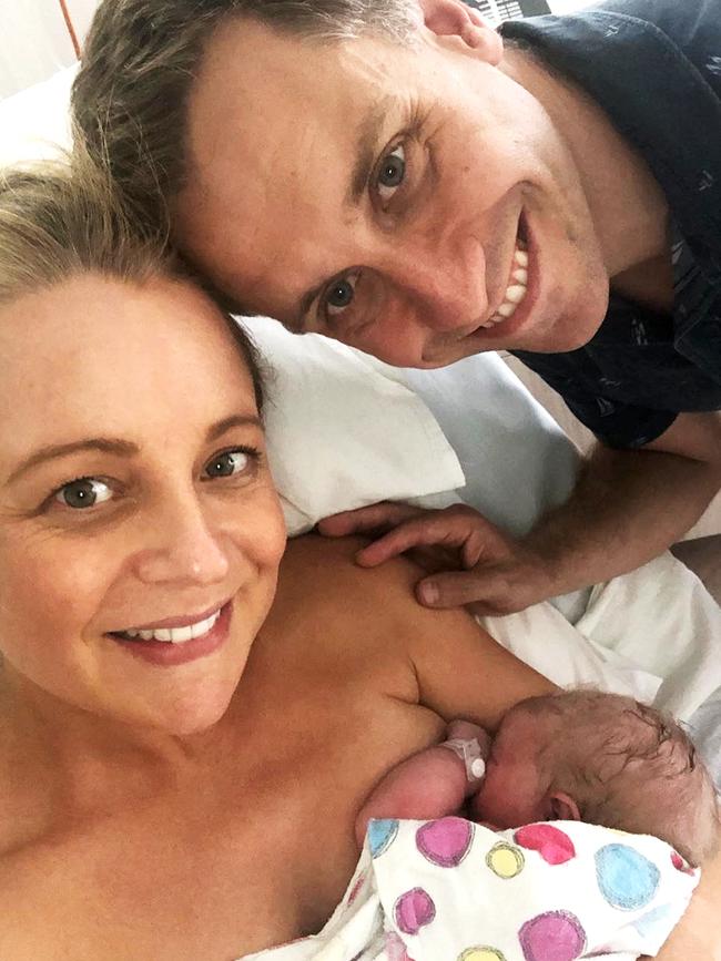 With newborn daughter Adelaide and partner Chris Walker. (Picture: Instagram)