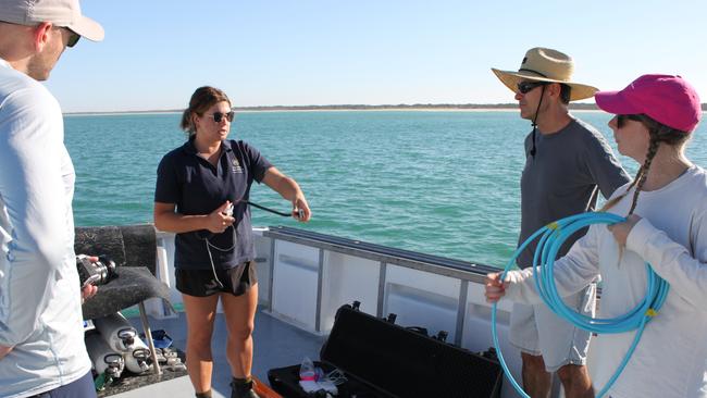 Maritime conservator Heather Berry helps researchers prepare the marine magnetometer for its deployment. Image: James Hunter.