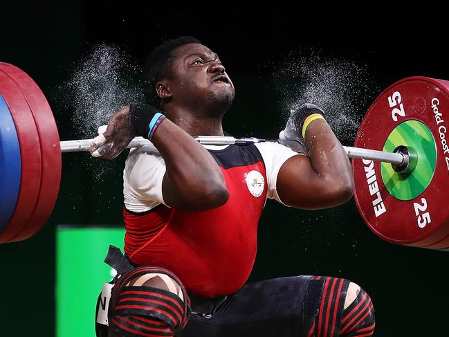 GOLD COAST, AUSTRALIA - APRIL 08:  Petit David Minkoumba of Cameroon competes in the Men's 94kg final during Weightlifting on day four of the Gold Coast 2018 Commonwealth Games at Carrara Sports and Leisure Centre on April 8, 2018 on the Gold Coast, Australia.  (Photo by Hannah Peters/Getty Images)