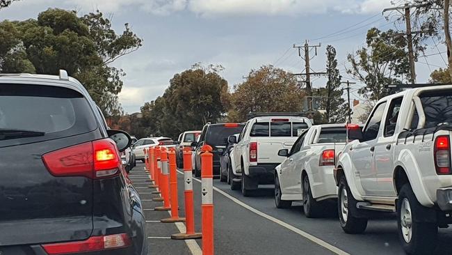 Cars lining up at a Mildura Covid testing clinic on Sunday hours after a local case emerged.