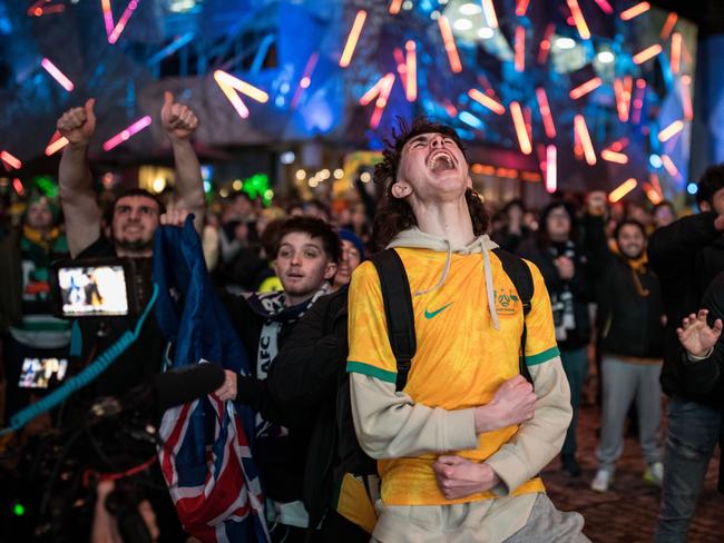 Fans at Federation Square in Melbourne celebrate the Matildas' win as they watch the opening FIFA Women's World Cup match in Australia between Australia and Ireland. Picture: Darrian Traynor / Getty Images