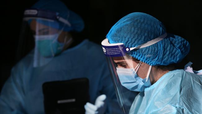 Medical staff assist locals queuing at a medical centre to undertake COVID-19 testing in Fairfield in 2021 in Sydney, Australia. Picture: Lisa Maree Williams/Getty Images.