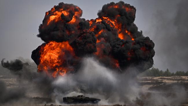 Troops from the Polish 18th Mechanised Division and the 82nd Airborne Division (USA) take part in tactical and fire training on April 8, 2022 in Nowa Deba, Poland. Picture: Jeff J Mitchell/Getty Images.