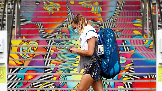 Clara Burel of France walks through Melbourne Park on Thursday. Picture: Getty Images