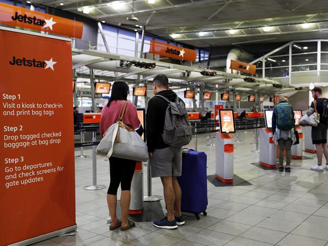 A small number of passengers at Jetstar’s self check-in consoles at Sydney Airport today. Picture: Getty Images