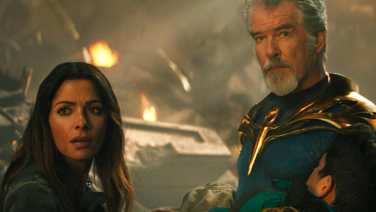 Sarah Shahi with MVP Pierce Brosnan. Picture: Warner Bros/New Line