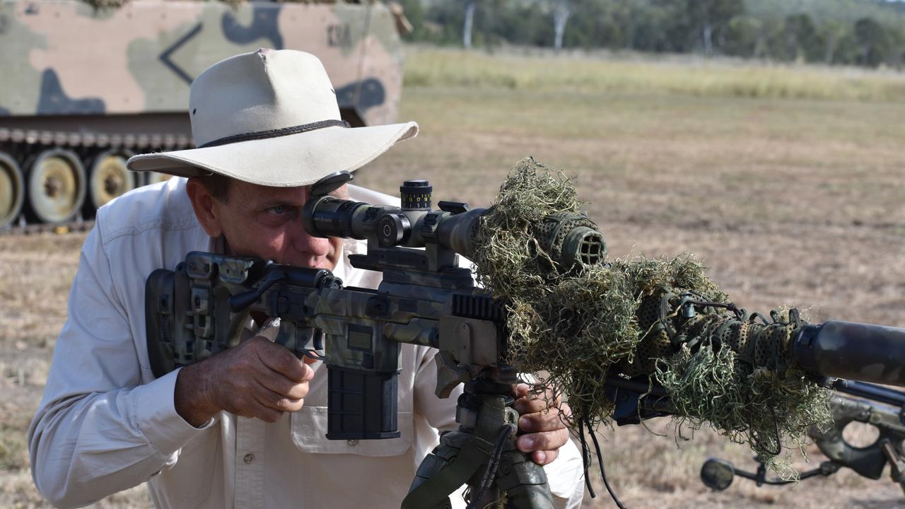 Rockhampton mayor Tony Williams with a sniper rifle at the Shoalwater Bay Training Area.