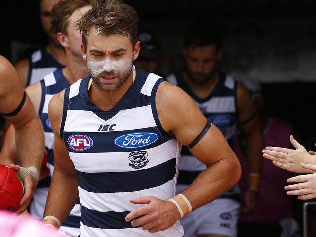 Geelong's Corey Enright heads out with a black armband at the NAB challenge in the Essendon vs Geelong match in Shepparton. Picture: Colleen Petch.