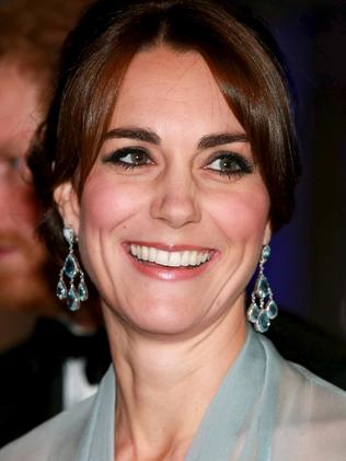 Prince Harry (L), Catherine, Duchess of Cambridge (C) and Prince William, Duke of Cambridge (R) attend The Cinema and Television Benevolent Fund's Royal Film Performance 2015 of the new James Bond 007 film "Spectre" at Royal Albert Hall on October 26, 2015 in London, England.REUTERS/Chris Jackson/Pool