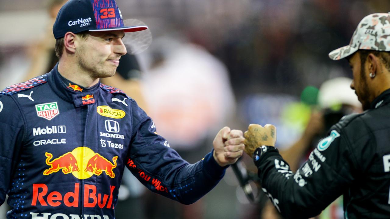 Lewis Hamilton congratulates Max verstappen on winning pole.