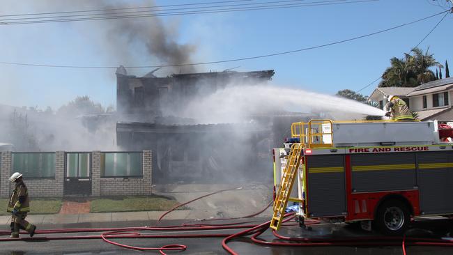 Emergency services fight a house fire. Picture Glenn Hampson