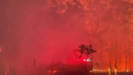 QPS are urging residents to leave immediately after a large fast moving fire threatens homes near Landsborough. Credit: Facebook