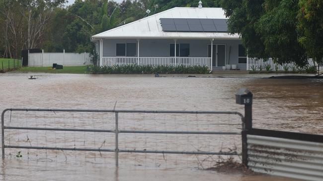 Water approaching a home at Bluewater north of Townsville. Picture: Adam Head