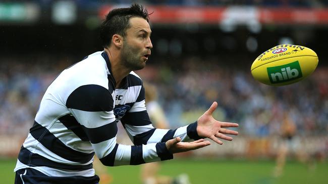 Winter isn’t far away and that means more long-sleeve days for Cats wet weather specialist Jimmy Bartel. Picture: Wayne Ludbey