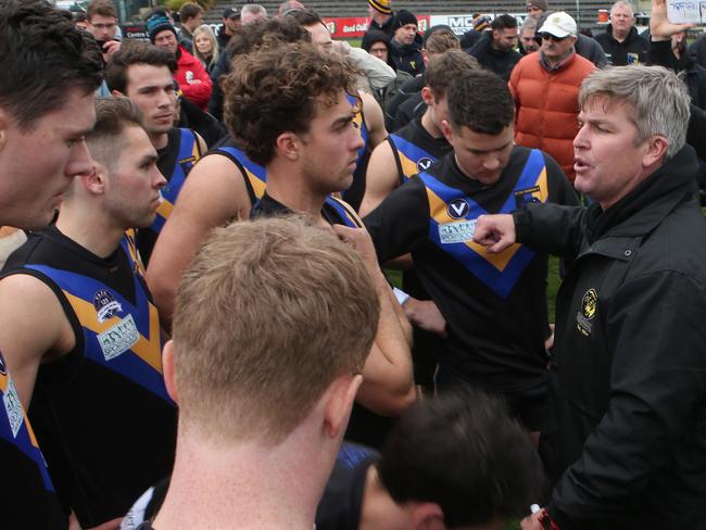 Old Carey coach Michael Tarrant with his players during the VAFA (Premier B): Old Carey v St Bernards game. Saturday, September 1. 2018. Picture: David Crosling