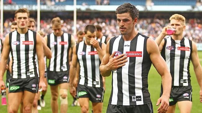 MELBOURNE, AUSTRALIA — MAY 07: Scott Pendlebury of the Magpies leads the Magpies from the field after losing the round seven AFL match between the Collingwood Magpies and the Carlton Blues at Melbourne Cricket Ground on May 7, 2016 in Melbourne, Australia. (Photo by Scott Barbour/Getty Images)
