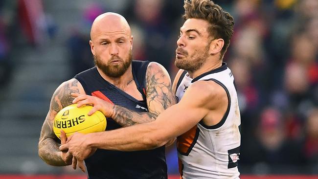 Nathan Jones is tackled by Stephen Coniglio.