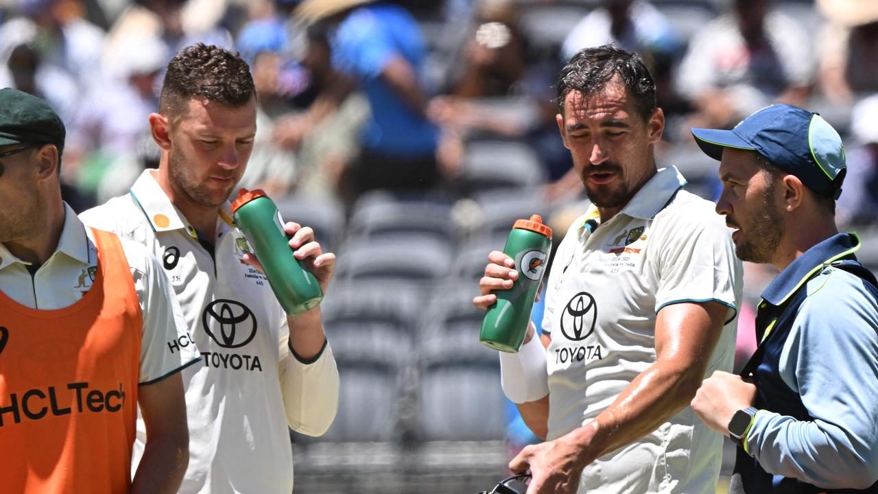 Josh Hazlewood and Mitchell Starc had to slog it out with the bat. (Photo by SAEED KHAN / AFP)