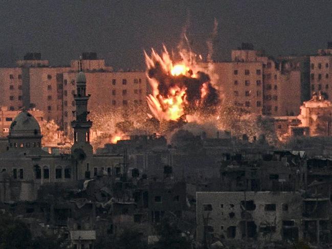 TOPSHOT - A fireball erupts during Israeli bombardment in the northern Gaza Strip on October 14, 2023. Thousands of people, both Israeli and Palestinians have died since October 7, 2023, after Palestinian Hamas militants entered Israel in a surprise attack leading Israel to declare war on Hamas in the Gaza Strip enclave on October 8. (Photo by Aris MESSINIS / AFP)