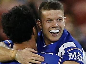 Bulldogs players Jack Cogger and Corey Harawira-Naera celebrate their win after the Round 17 NRL match between the Newcastle Knights and the Canterbury Bulldogs at McDonald Jones Stadium in Newcastle, Friday, July 12, 2019.  (AAP Image/Darren Pateman) NO ARCHIVING, EDITORIAL USE ONLY