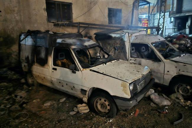 Damaged cars after an Israeli strike targeted a neighbourhood in the southern Lebanese city of Tyre