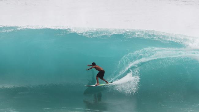 Surfers at Snapper Rocks and Kirra riding the Large swell produced by Cyclone OMA. Photograph : Jason O'Brien