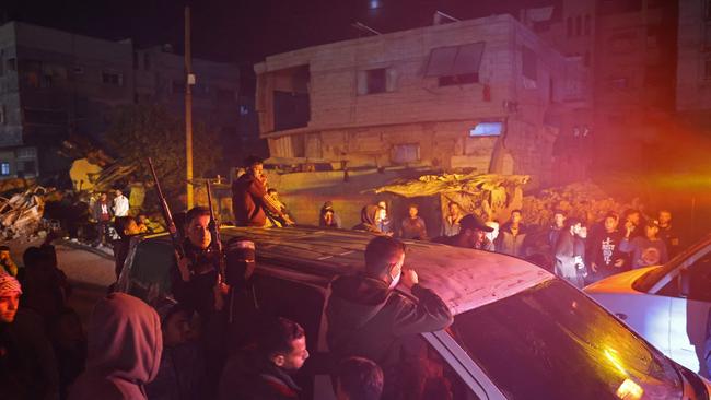 Members of Hamas's armed wing, the Ezzedine al-Qassam Brigades, arrive in a vehicle at a street in Khan Yunis. Picture: AFP