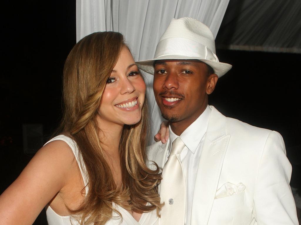 Singer Mariah Carey and former husband Nick Cannon attend a White Party hosted by Sean "Diddy" Combs in 2009. There is no suggestion they had any knowledge of alleged criminal acts. Picture: Getty Images.