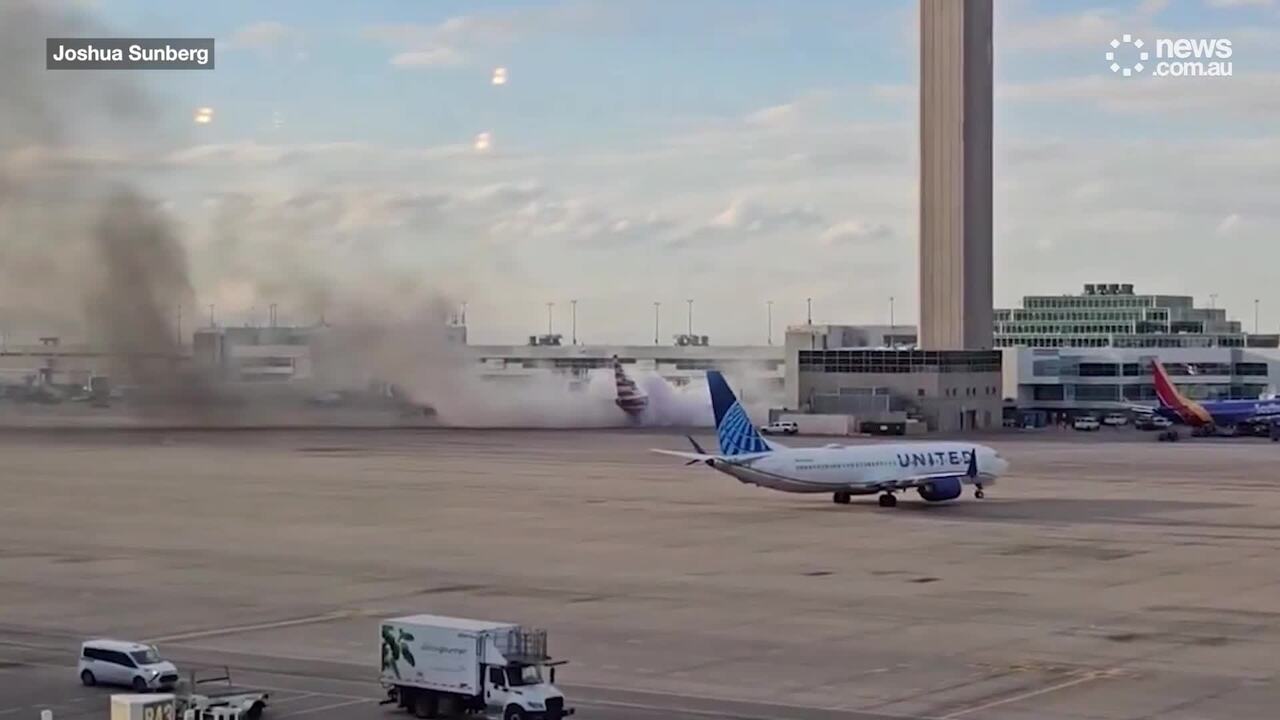 American Airlines flight catches fire at Denver International Airport