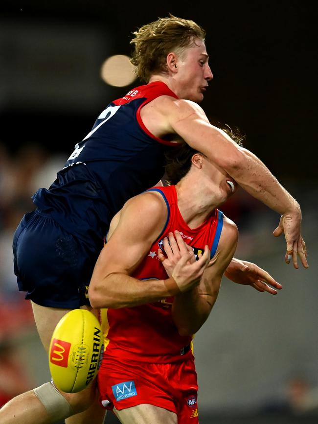 Charlie Ballard of the Suns suffers an injury while challenging for the ball against Jacob van Rooyen of the Demons during the round eight AFL match between the Gold Coast Suns and Melbourne Demons. Picture: Albert Perez / Getty