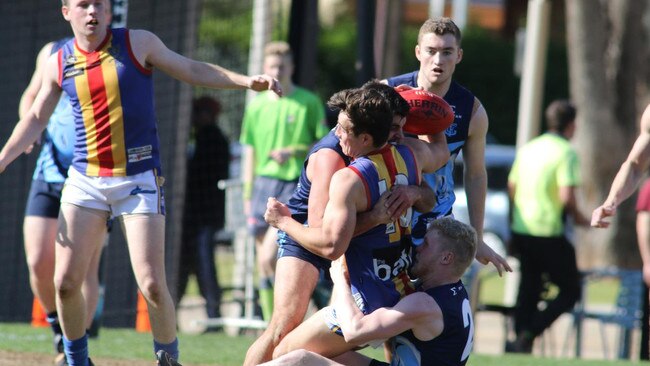 Alex Haren lays a tackle on Old Ignatians’ Sam Boots. Picture: Russell Millard