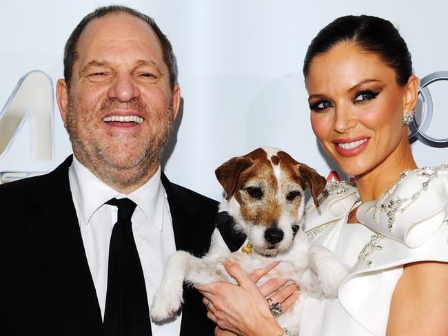 Harvey Weinstein, Uggie the dog from The Artist and designer Georgina Chapman in 2012. Picture: Getty