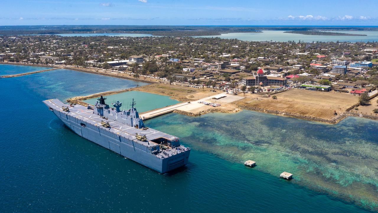 HMAS Adelaide sitting alongside Nuku'alofa to deliver humanitarian stores and medical supplies. Picture: POIS Christopher Szumlanski / Australian Defence Force / AFP