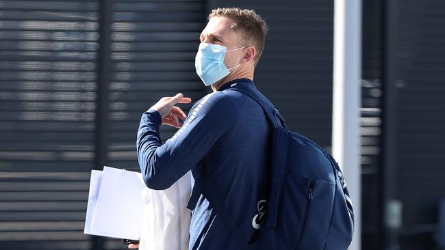 Joel Selwood wearing a face mask after touching down in Perth. Picture: Getty Images