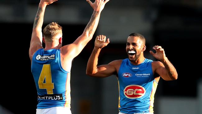 Brandon Ellis and Touk Miller celebrate the win over Sydney. Picture: Matt King/AFL Photos