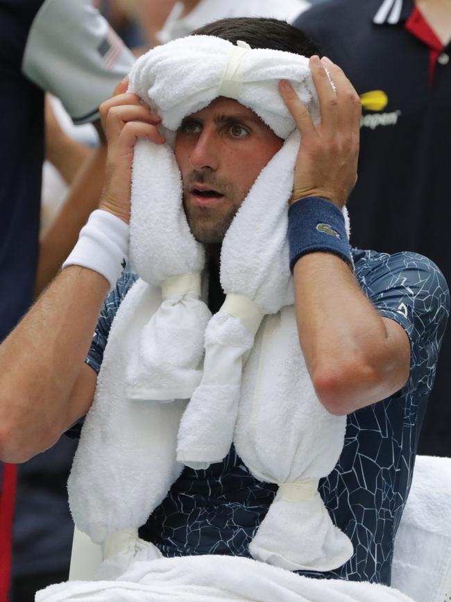 Novak Djokovic, of Serbia, uses ice towels to cool off during a changeover in his match against Marton Fucsovics, of HungaryPicture: AP Photo