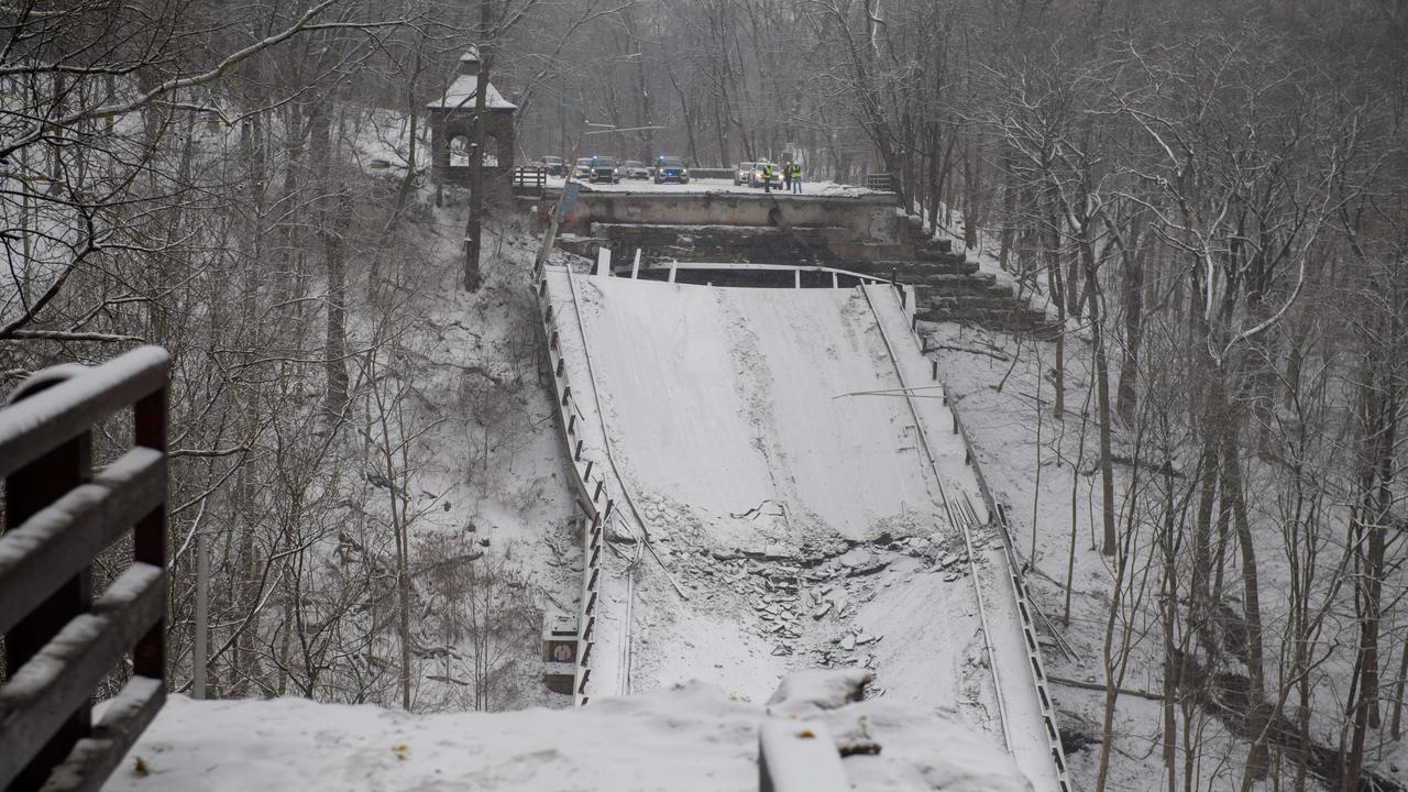 The collapsed bridge is seen along Forbes Ave. At least 10 people were reportedly injured in the early-morning collapse, hours ahead of a scheduled visit by Joe Biden. Picture: AFP.