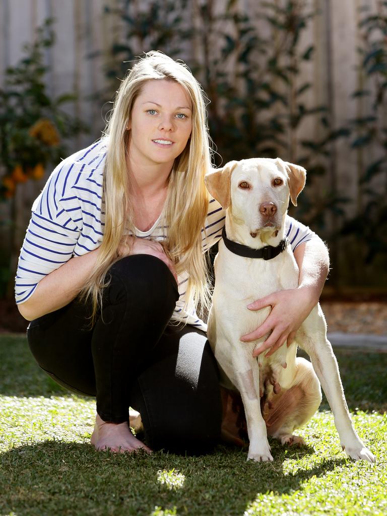 Shae Barnfield adopted Tillie after her rescue, giving the Labrador a new life. Picture: Troy Snook