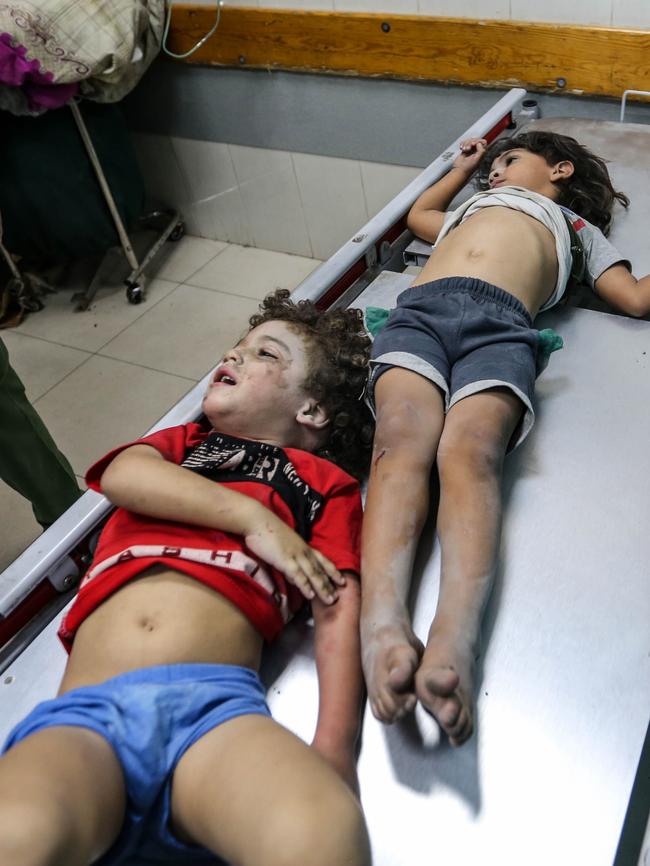 Palestinian children injured in Israeli air raids arrive at Nasser Medical Hospital on October 26 in Gaza. Picture: Getty