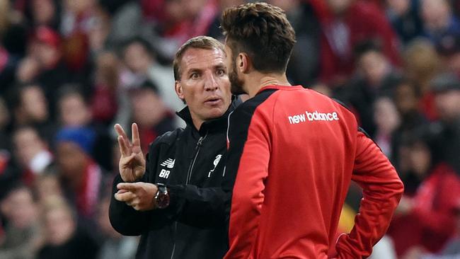 Manager Brendan Rodgers (left) gestures to Adam Lallana during the Liverpool FC training session at Suncorp Stadium in Brisbane, Thursday, July 16, 2015. Liverpool play Brisbane Roar in a friendly match in Brisbane Friday (AAP Image/Dave Hunt) NO ARCHIVING