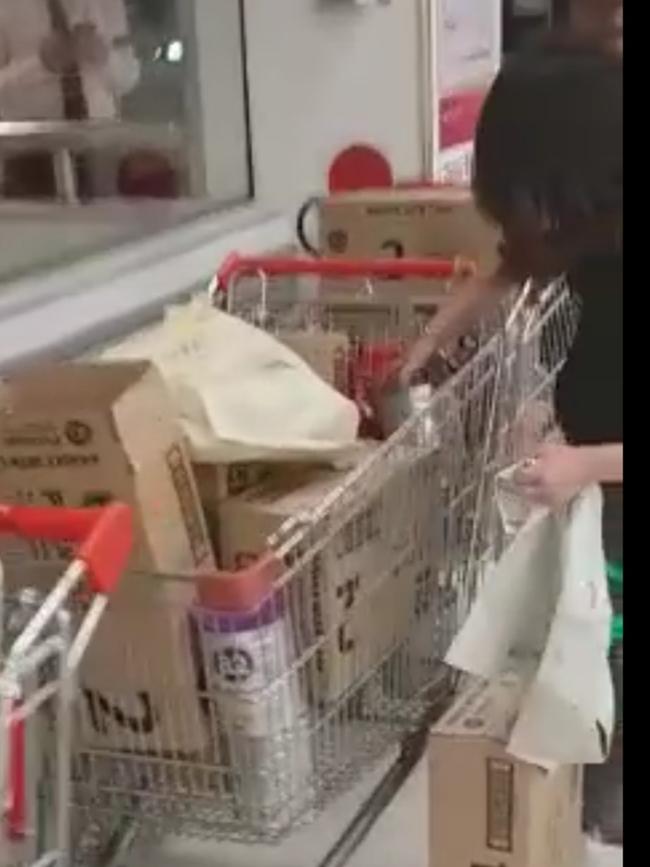 One of the shoppers packing the formula she just bought.