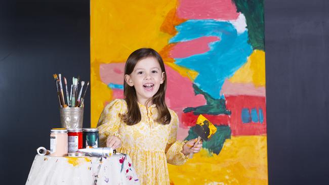 Four year old Claudia Buchanan is creating paintings coveted by some big names in art. Picture: AAP/Renae Droop