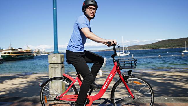 Liam Clark using a Reddy Go bike at Manly esplanade. Picture Adam Yip