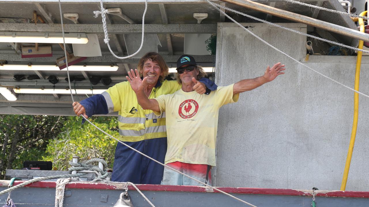 Christopher 'Harry' Harris and John Rigby on board Queenslander tied up in Packers Inlet in preparation of Cyclone Jasper's expected arrival in Port Douglas. Picture: Peter Carruthers