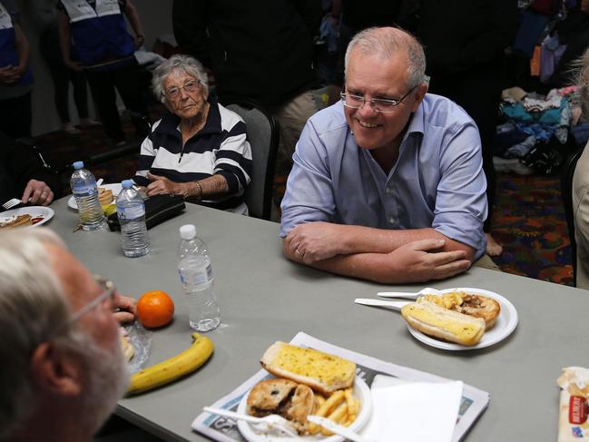 Scott Morrison talking to stranded locals at Club Taree Evacuation Centre in Taree, NSW, during bushfires. Picture: AAP