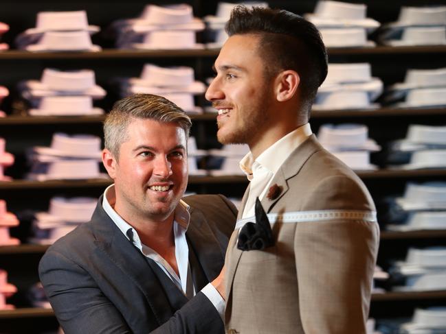 Pictured at Peter Jackson men's wear store at Westfield in Sydney is David Jackson taking suit measurements for Costa Sclavos. More and more men are seeking personally tailored suits. Picture: Richard Dobson